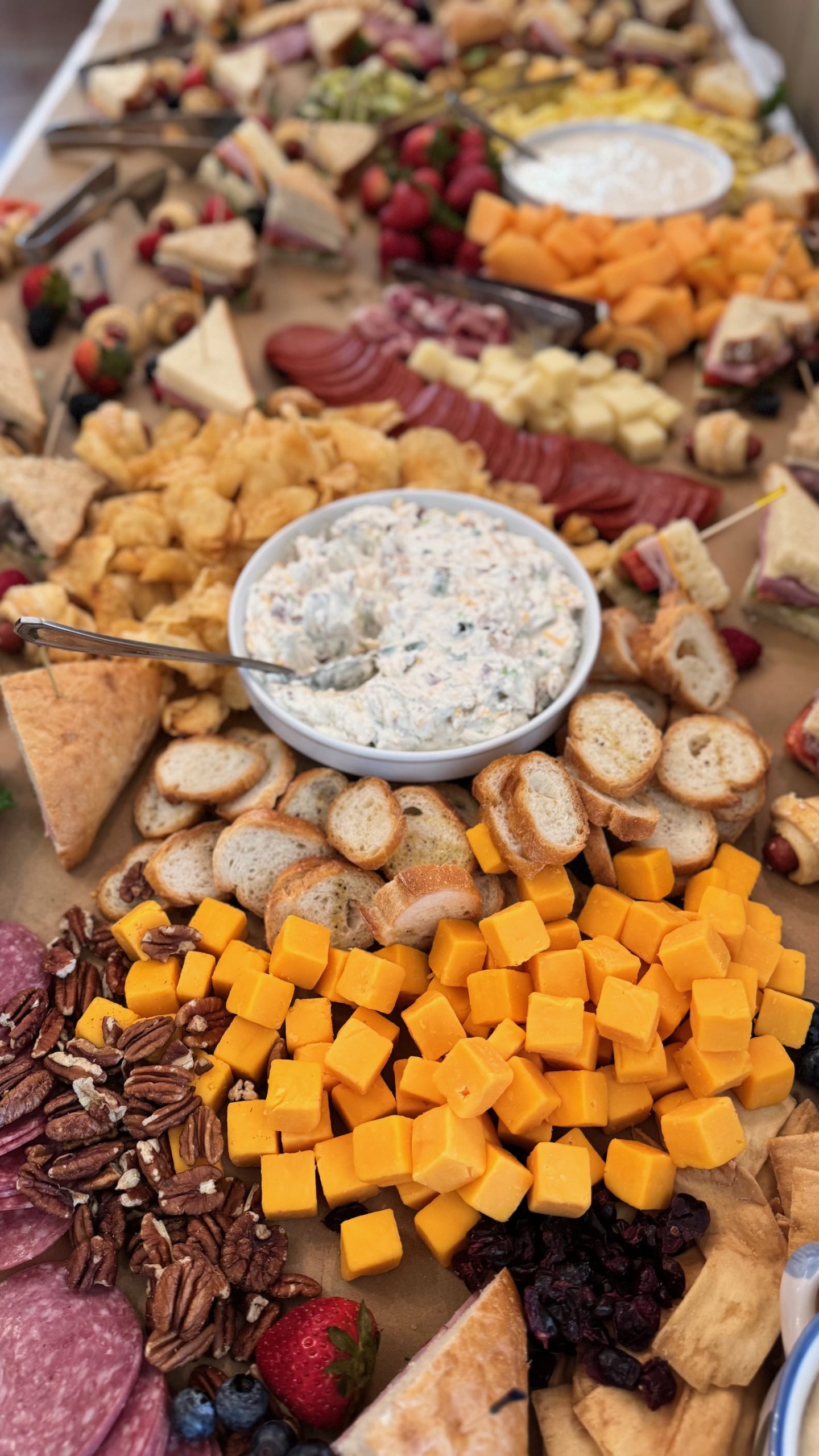 Catering grazing board with cheeses, charcuterie, and fresh breads at Silver Sycamore