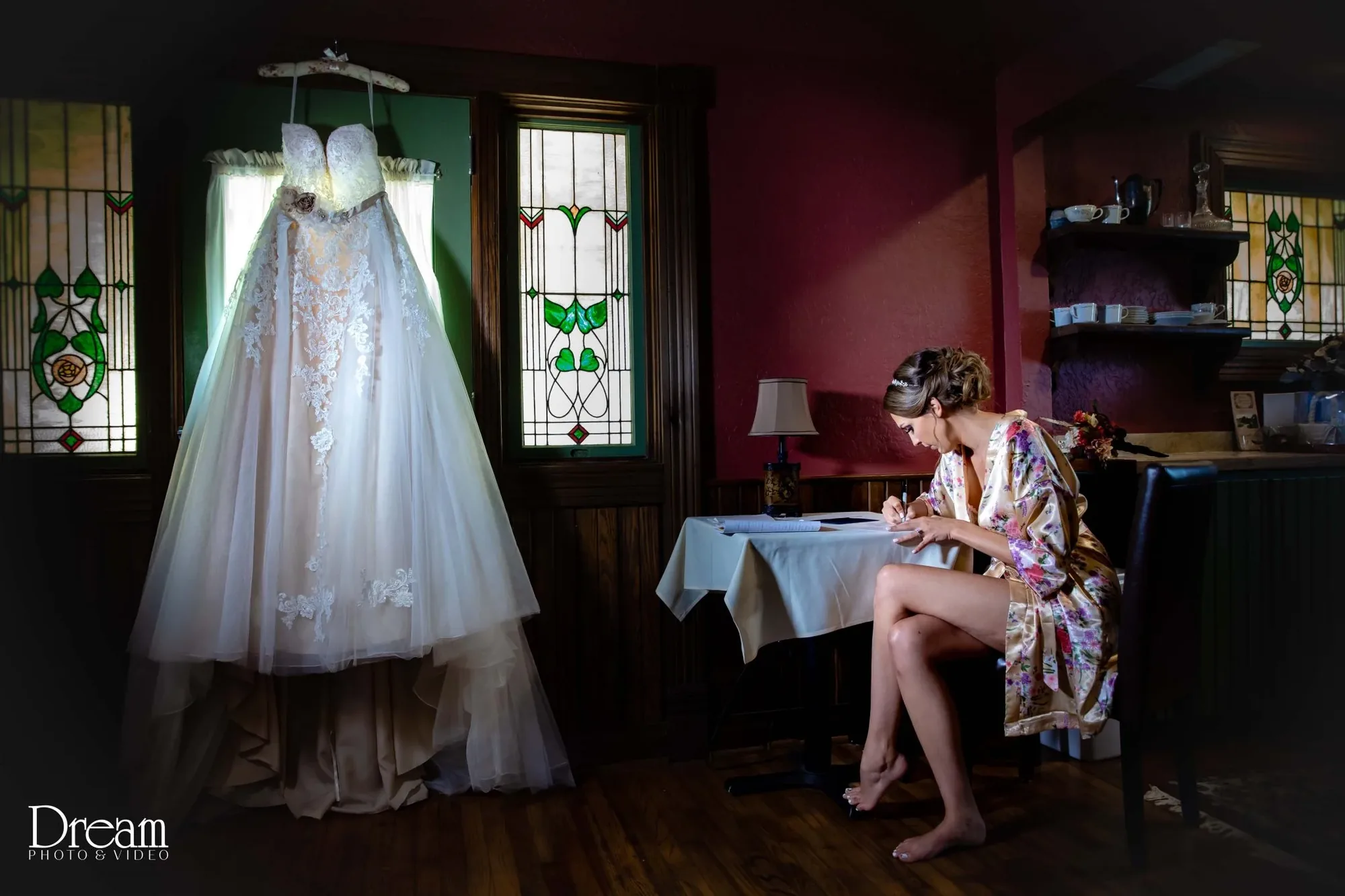 Bride writing vows in morning light